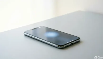 A modern smartphone on a minimalist desk displaying a subtle notification, representing digital updates and modern alternatives to the phrase "stay tuned".